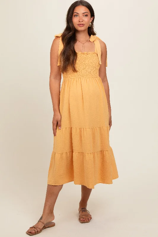 Maternity dress for a fall harvest festival Yellow Smocked Tie Strap Tiered Maternity Midi Dress Maternity dress for a fall harvest festival Yellow Smocked Tie Strap Tiered Maternity Midi Dress